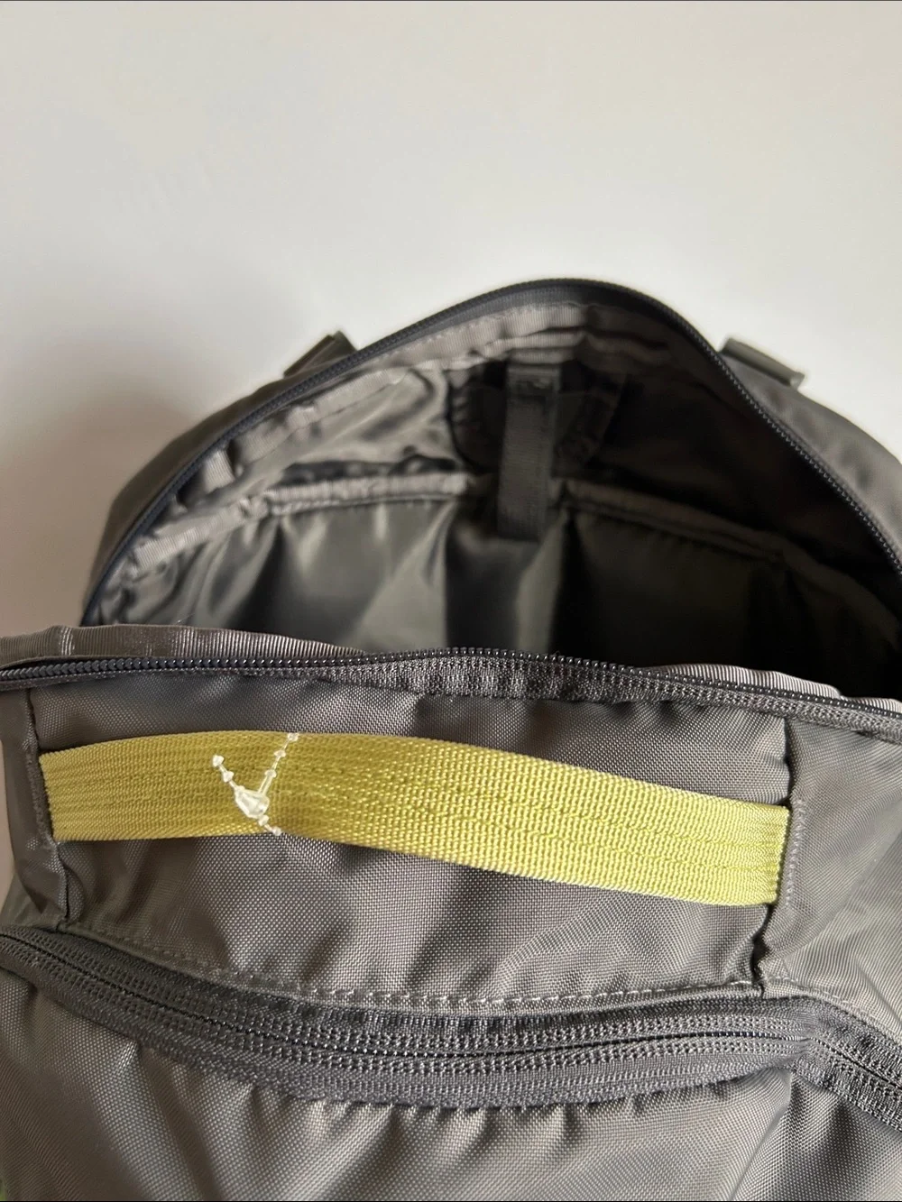Patagonia Gray Backpack with Yellow Bungee Accents